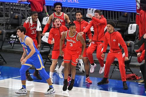 Ohio State bench celebrating a shot made by #3 Eugene Brown