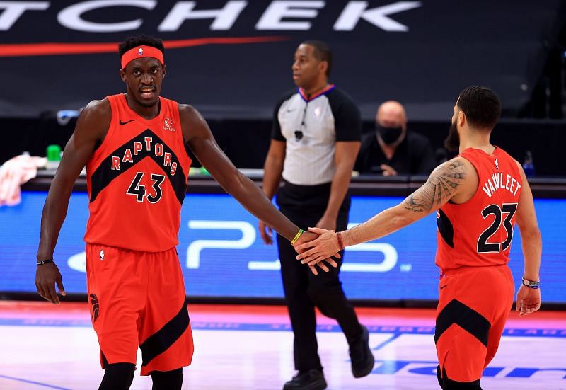 Pascal Siakam of the Toronto Raptors is congratulated by Fred VanVleet during a game against the Sacramento Kings at Amalie Arena on January 29, 2021, in Tampa, Florida. (Photo by Mike Ehrmann/Getty Images)