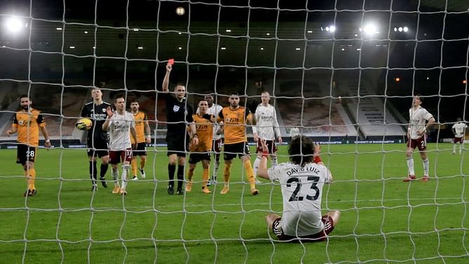 Sloppy Arsenal punished by Wolves as top-four hopes wither once again