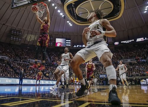 Amir Coffey #5 of the Minnesota Golden Gophers dunks the ball as Carsen Edwards #3 of the Purdue Boilermakers