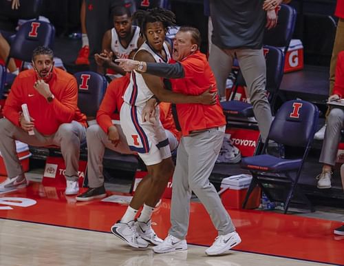 Ayo Dosunmu #11 of the Illinois Fighting Illini collides with head coach Brad Underwood