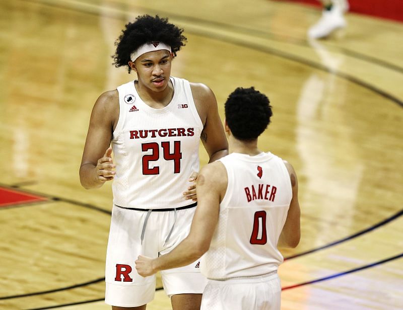 Ron Harper Jr. #24 of the Rutgers Scarlet Knights, celebrates with teammate Geo Baker #0
