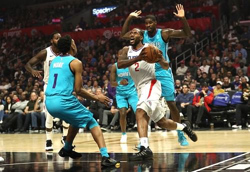 Kawhi Leonard #2 drives to the basket as Malik Monk #1 and Bismack Biyombo #8 defend. (Photo by Sean M. Haffey/Getty Images)