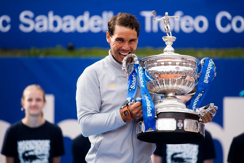 Rafael Nadal poses with the winner&#039;s trophy at the Barcelona Open in 2018