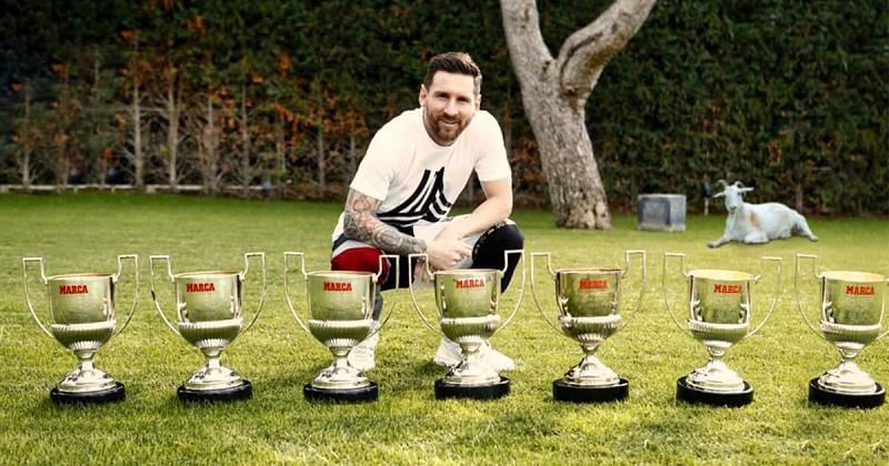 Lionel Messi posing with his record seven Pichichi awards
