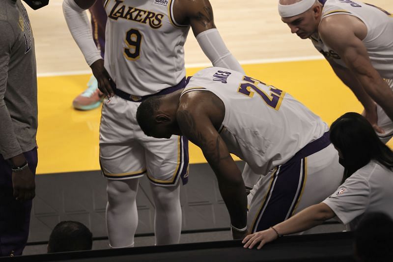 LeBron James #23 reacts to an apparent injury during the second period of a game against the Atlanta Hawks. (Photo by Michael Owens/Getty Images)