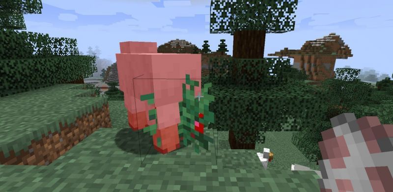 Shown: A sheep being hurt by a Sweet Berry bush (Image via Minecraft)