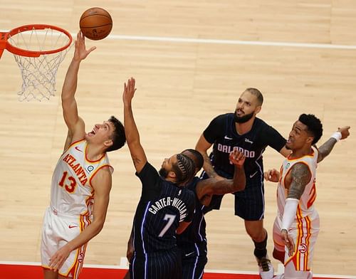 Bogdan Bogdanovic of the Atlanta Hawks lays it in against Michael Carter-Williams of the Orlando Magic