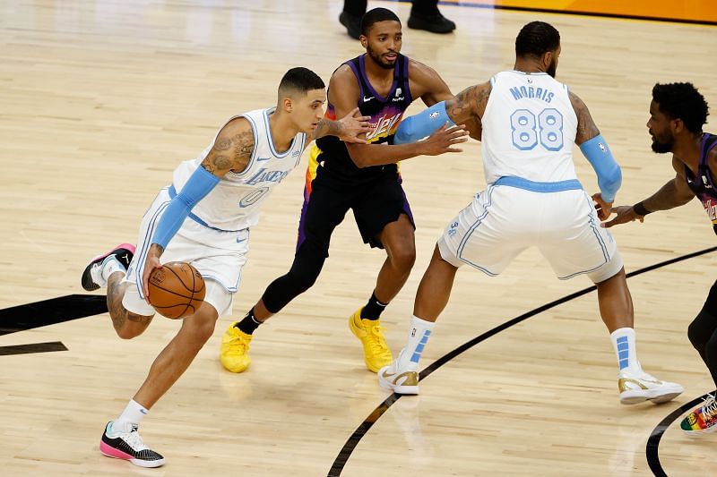 Kyle Kuzma #0 handles the ball ahead of Mikal Bridges #25. (Photo by Christian Petersen/Getty Images)