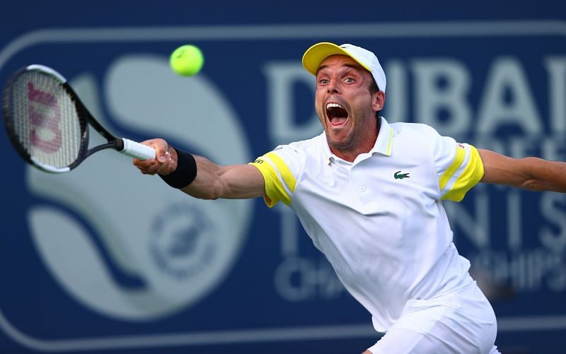 Roberto Bautista Agut retrieves a ball