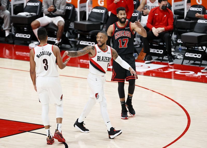 CJ McCollum #3 and Damian Lillard #0 of the Portland Trail Blazers react after a basket against the Chicago Bulls. (Photo by Steph Chambers/Getty Images)