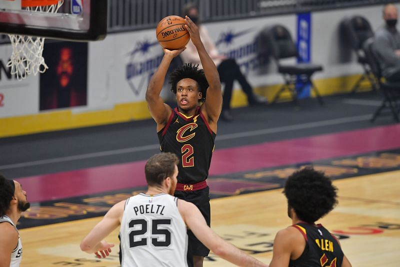 Collin Sexton #2 shoots over Jakob Poeltl #25. (Photo by Jason Miller/Getty Images)