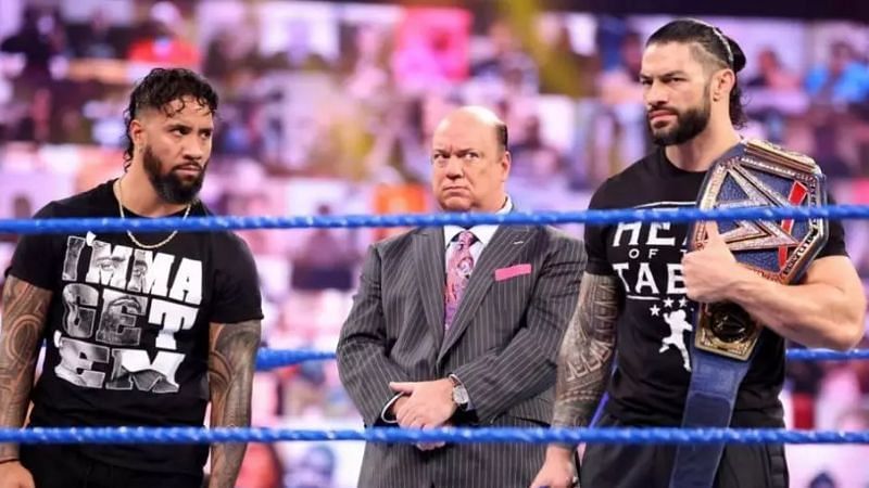 Jey Uso, Paul Heyman, and Roman Reigns.