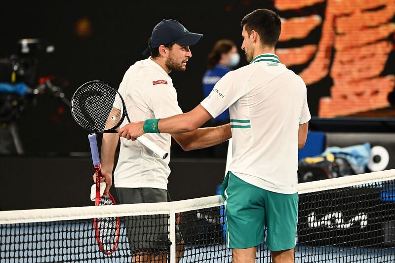 Aslan Karatsev (L) and Novak Djokovic after their 2021 Australian Open semifinal