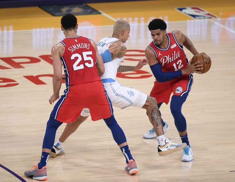 Tobias Harris #12 of the Philadelphia 76ers attempt to use the screen from Ben Simmons #25.