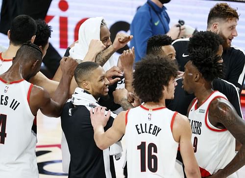 Damian Lillard #0 of the Portland Trail Blazers gathers his teammates after defeating the Minnesota Timberwolves 135-117