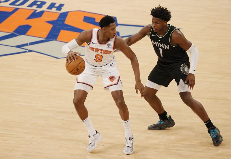 RJ Barrett #9 of the New York Knicks dribbles against Anthony Edwards #1 of the Minnesota Timberwolves. (Photo by Sarah Stier/Getty Images)