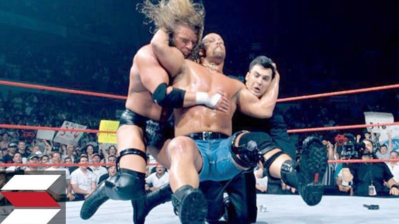 The Stone Cold Stunner on Triple H and Shane McMahon.