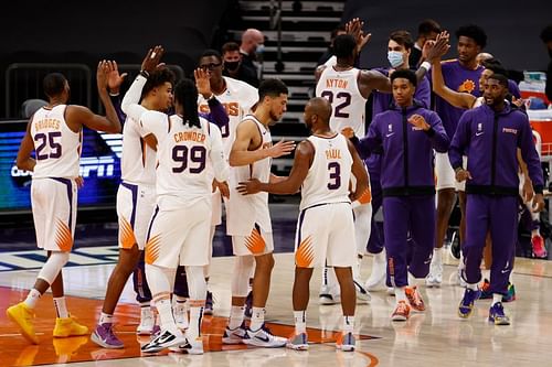 Devin Booker #1 of the Phoenix Suns celebrates with Chris Paul #3 (Photo by Christian Petersen/Getty Images)