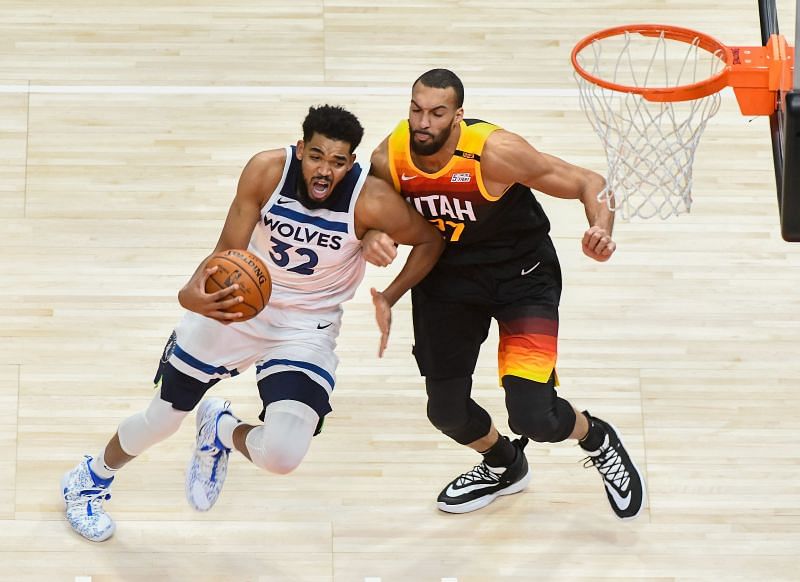 Karl-Anthony Towns #32 drives against Rudy Gobert #27. (Photo by Alex Goodlett/Getty Images).