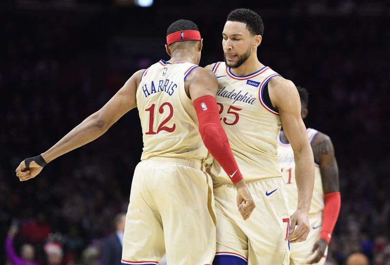 Tobias Harris #12 chest-bumps Ben Simmons #25 of the Philadelphia 76ers.