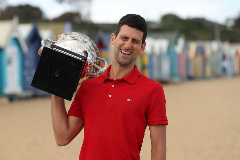 Novak Djokovic poses with the 2021 Australian Open trophy