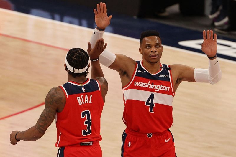 Russell Westbrook #4 of the Washington Wizards celebrates with teammate Bradley Beal #3 against the Los Angeles Clippers. (Photo by Patrick Smith/Getty Images)