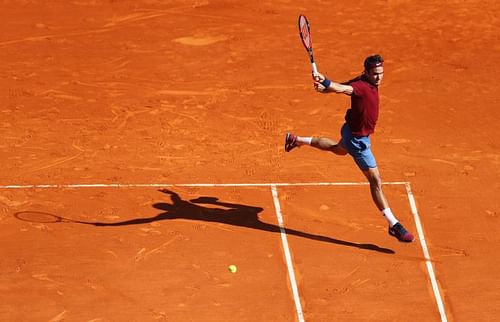 Roger Federer striking a backhand