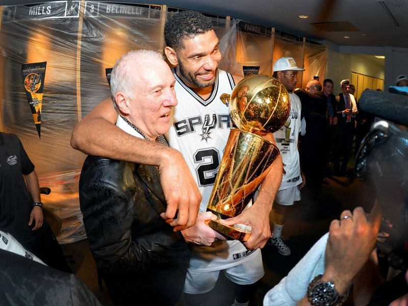 Tim Duncan, coach Gregg Popovich and the San Antonio Spurs celebrate their 2014 NBA title.