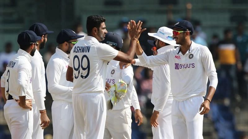 Ravichandran Ashwin and Axar Patel with teammates