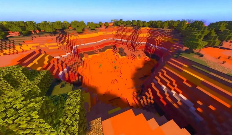 A stunning pit in the midst of a badlands biome in Minecraft (Image via Minecraft &amp; Chill / YouTube)