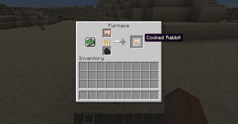 Cooking raw rabbit meat at a furnace in Minecraft. (Image via Minecraft)