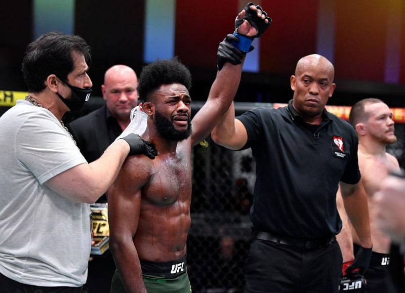 Aljamain Sterling gets his hand raised by referee Mark Smith at UFC 259.