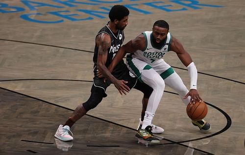 Boston Celtics star Jaylen Brown battles against Kyrie Irving of the Brooklyn Nets