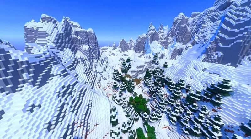 A picturesque valley of trees surrounded by snow-capped mountains in Minecraft (Image via Minecraft &amp; Chill/YouTube)