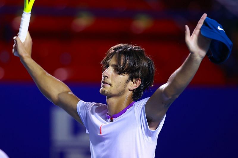 Lorenzo Musetti celebrates after beating Grigor Dimitrov