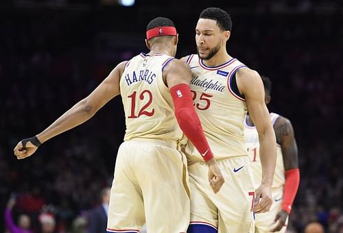 Tobias Harris #12 chest-bumps Ben Simmons #25. (Photo by Sarah Stier/Getty Images)