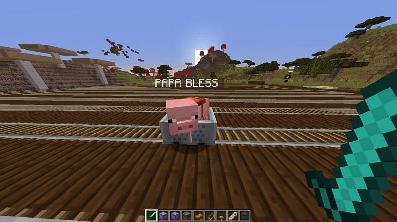 A pig with a saddle in a Minecart (Image via u/fxceless725 on Reddit)