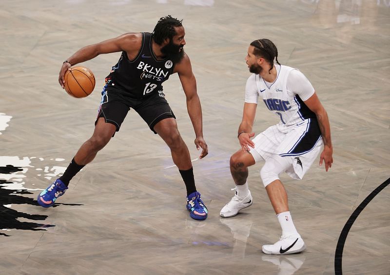 James Harden #13 of the Brooklyn Nets in action against Michael Carter-Williams #7 of the Orlando Magic.