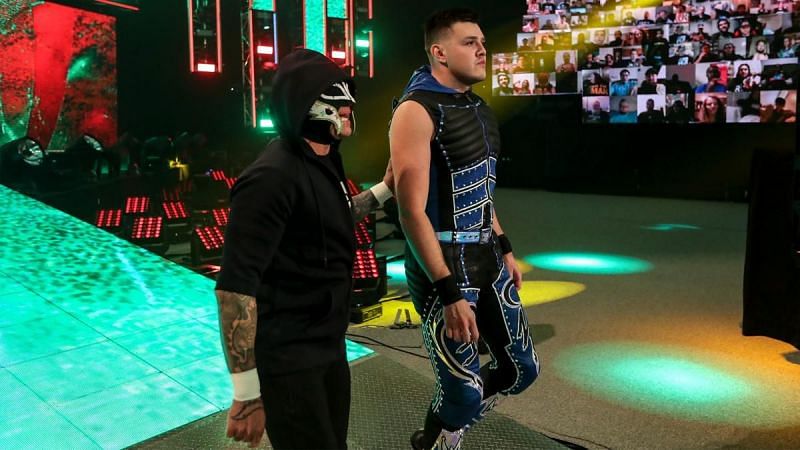 Dominik Mysterio (right) and his father Rey Mysterio (left)