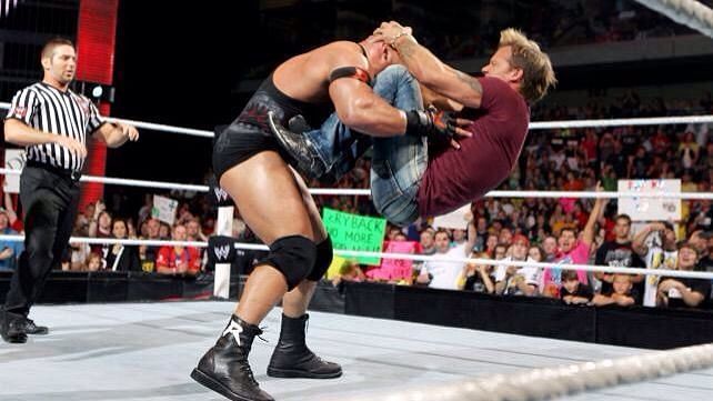 Chris Jericho hitting The Codebreaker on Ryback.