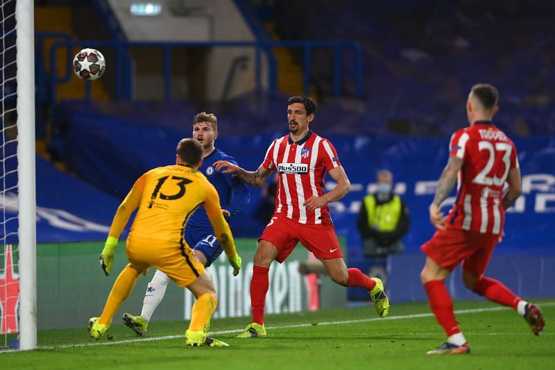 Atletico defenders and stopper Jan Oblak look upon as Timo Werner for Chelsea take a shot at the goal.