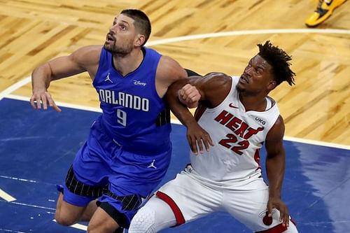 Nikola Vucevic (#9) and Jimmy Butler (#22) of the Miami Heat