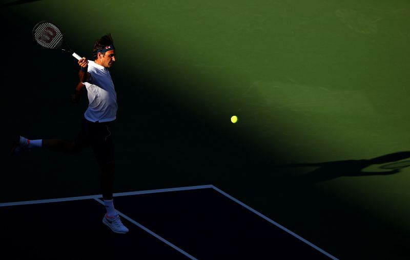 Roger Federer striking a backhand.