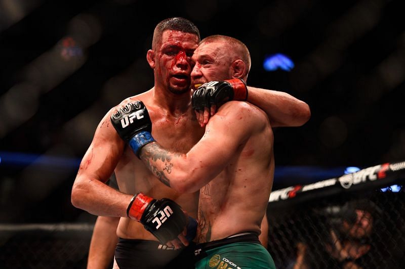 Nate Diaz hugs Conor McGregor after UFC 202