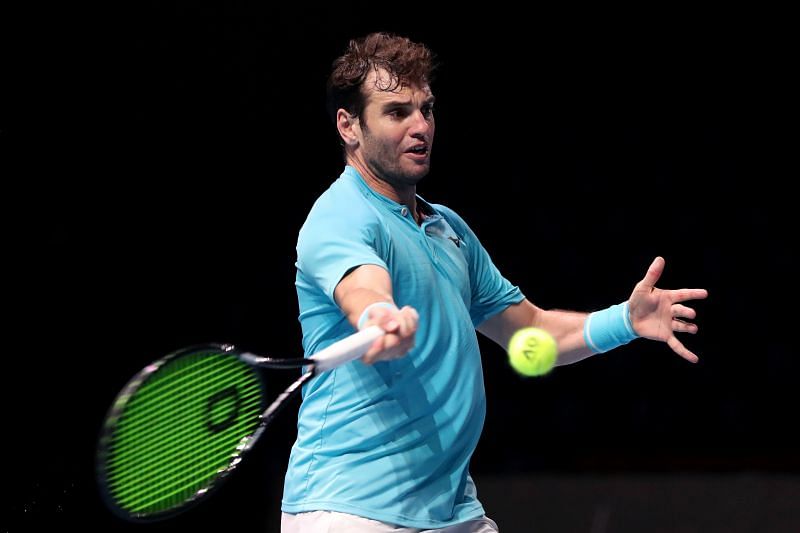 Malek Jaziri hits a forehand