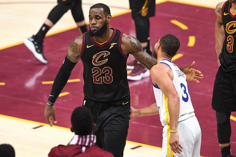 LeBron James #23 of the Cleveland Cavaliers shakes hands with Stephen Curry #30 of the Golden State Warriors during Game Four of the 2018 NBA Finals. (Photo by Jason Miller/Getty Images)