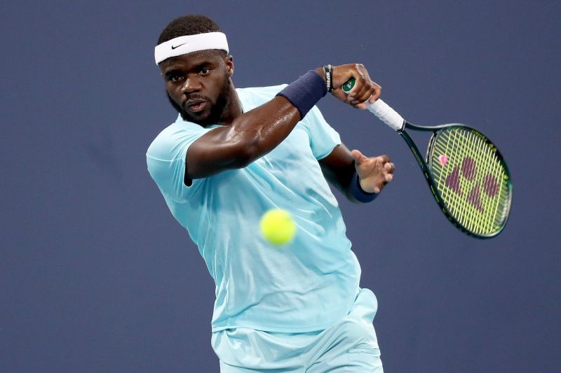 Frances Tiafoe in action against Daniel Evans in his second round match