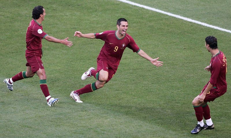 Pauleta (centre) celebrates with Cristiano Ronaldo (right)