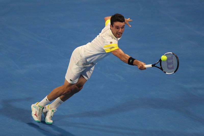 Roberto Bautista Agut retrieves a ball